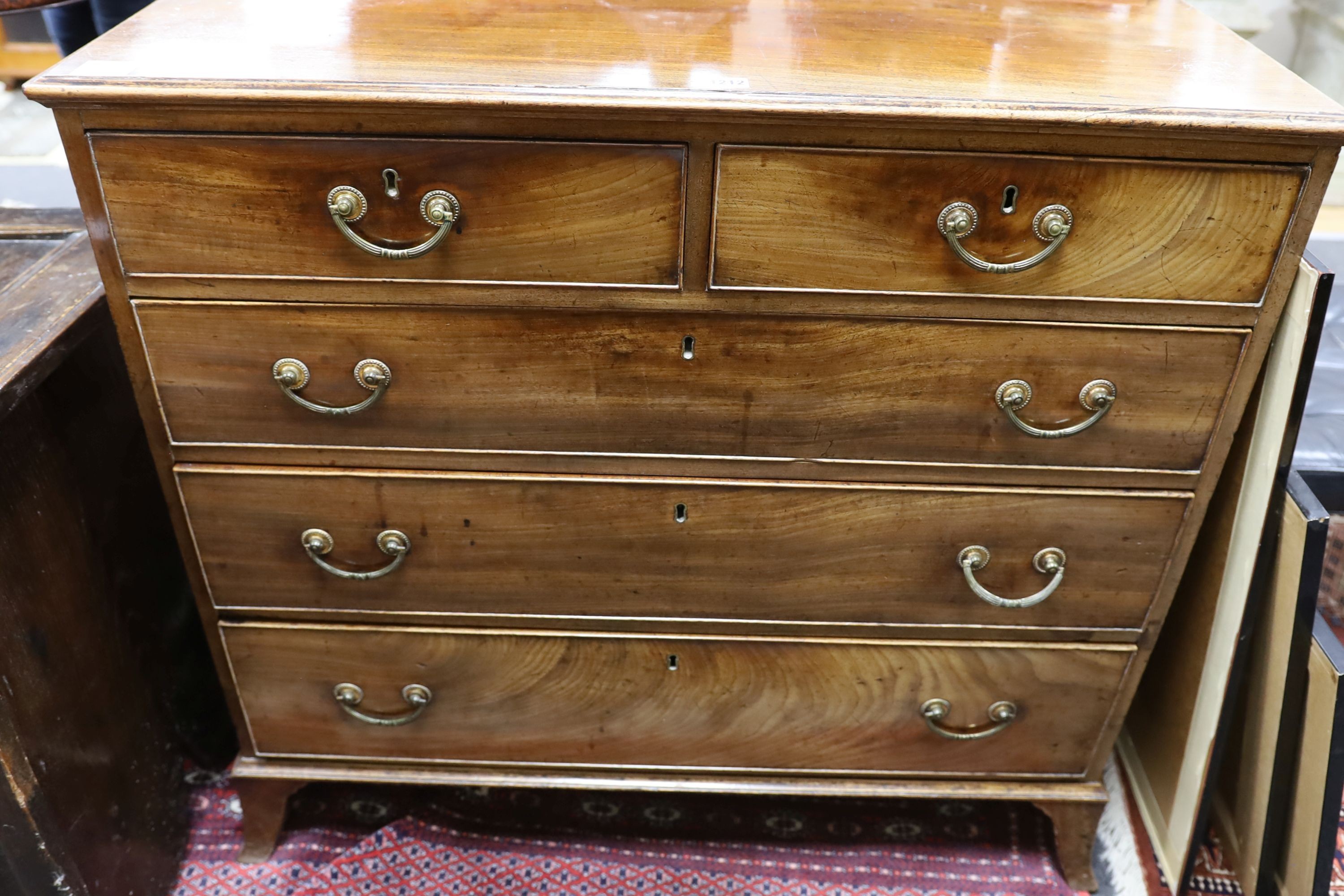 A George III mahogany chest, fitted two short and three long oak lined drawers, width 95cm, depth 51cm, height 89cm